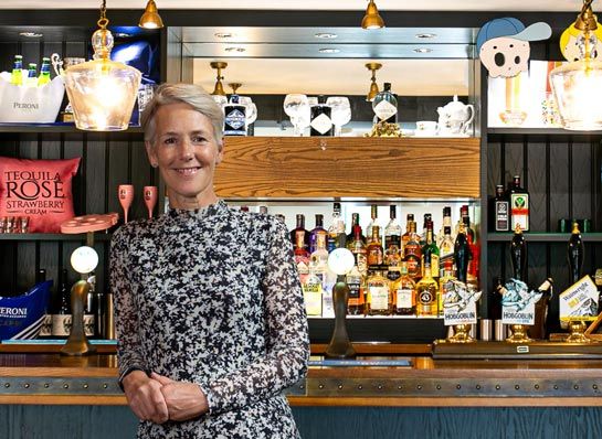Photo of Octavia Morley standing at a bar